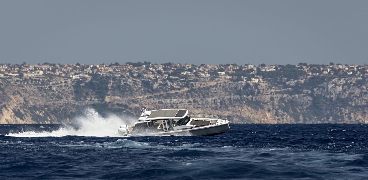 Axopar 37 luxury boat charter cruising along scenic Mallorca coastline