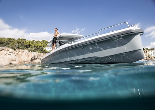 Axopar 37 boat cruising at high speed through Mediterranean waters